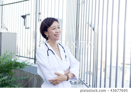 Fifties female doctor nurse Fifties female doctor nurse 43677695