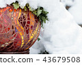 Cold snow day with close-up of gold, red, yellow, orange, bright multicolored stained glass mosaic 43679508