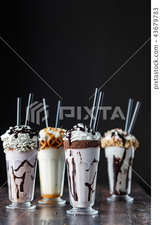 milk cocktails on black background milk cocktails on black background 43679783