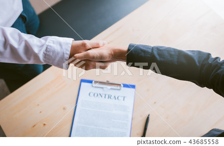 Dealer partnerships people shaking hands 43685558