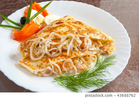 hot pancake with squid and carrots and sauce hot pancake with squid and carrots and sauce 43688762
