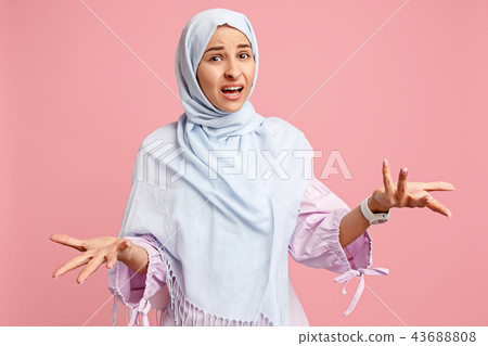 Argue, arguing concept. arab woman in hijab. Portrait of girl, posing at studio background Argue, arguing concept. arab woman in hijab. Portrait of girl, posing at studio background 43688808