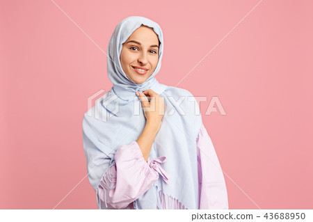 Happy arab woman in hijab. Portrait of smiling girl, posing at studio background 43688950