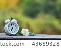 Red heart shape in shopping cart and white clock 43689328