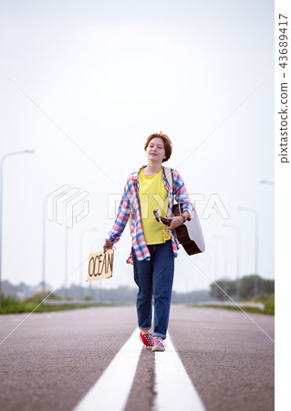 girl with a guitar hitch-hiking girl with a guitar hitch-hiking 43689417