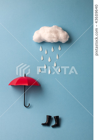 Rainbow and rain umbrella and boots on blue background 43689640
