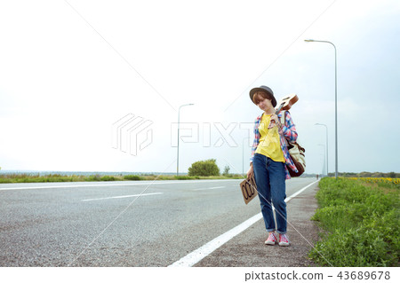 girl with a guitar hitch-hiking girl with a guitar hitch-hiking 43689678