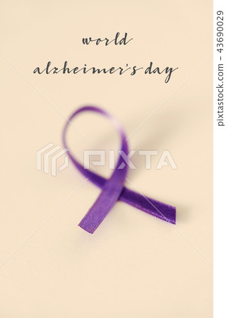 purple ribbon and text world alzheimers day 43690029
