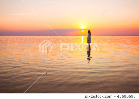 little girl looks at the sunset 43690695