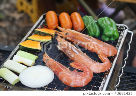 Eating outside at barbecue Eating outside at barbecue 43691425
