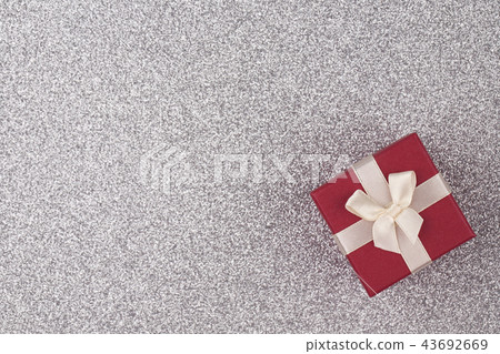 Gift box on silver background 43692669