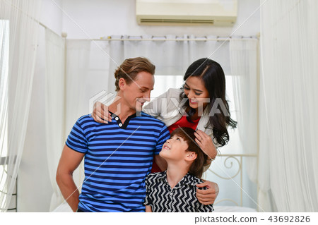 Family Concept. Family is happy in the house. Family is doing ac 43692826