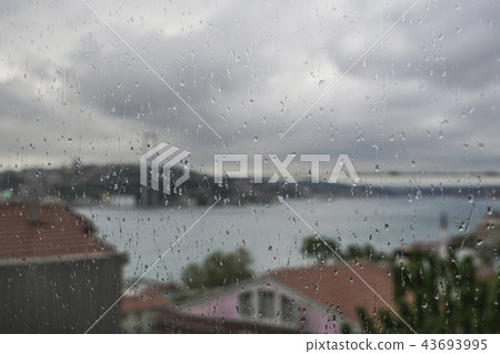 Rain drops on window against Istanbul, Turkey 43693995