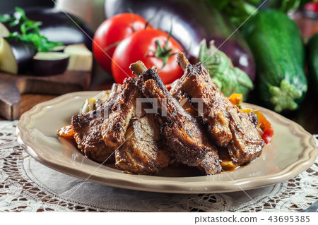 Roasted lamb chops served with ratatouille 43695385