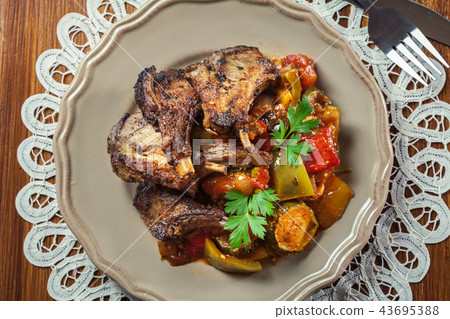 Roasted lamb chops served with ratatouille 43695388