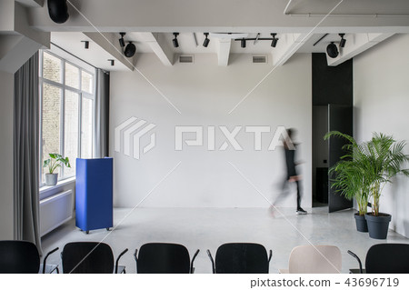 Stylish interior in loft style with gray walls 43696719