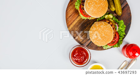 Homemade hamburgers, flat lay Homemade hamburgers, flat lay 43697293