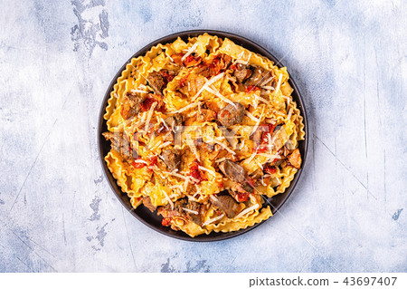 Pasta with chicken liver sauce. 43697407