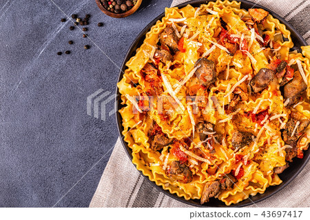 Pasta with chicken liver sauce. 43697417