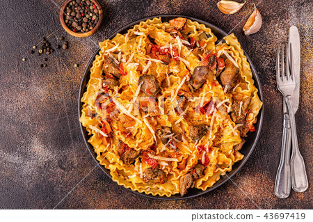 Pasta with chicken liver sauce. 43697419