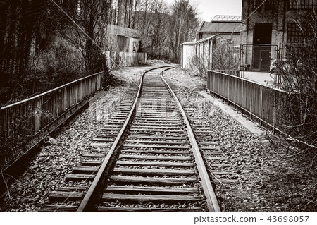 Raiload going through an industrial area Raiload going through an industrial area 43698057