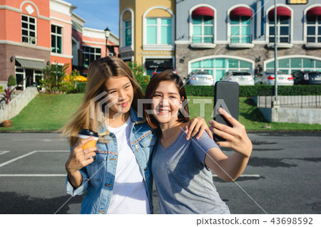 Asian friends women using a smartphone.  43698592