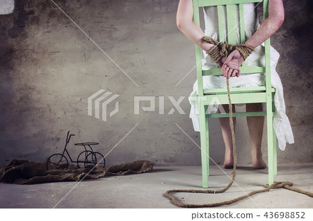 Young girl tied up on the floor. The abducted... - Stock Photo ...