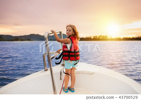 Kids sail on yacht in sea. Child sailing on boat. Kids sail on yacht in sea. Child sailing on boat. 43700529