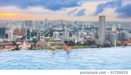 Kids swim in Singapore roof top swimming pool 43700658