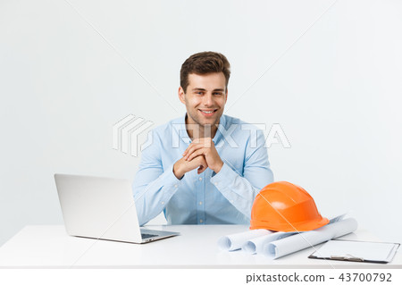 Handsome male construction engineer working in the office with laptop 43700792
