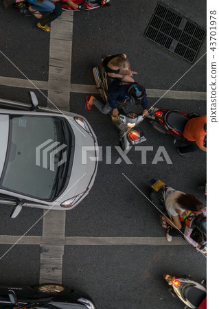 Car and Motorcycle at intersection with traffic 43701978