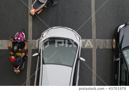 Car and Motorcycle at intersection with traffic 43701979