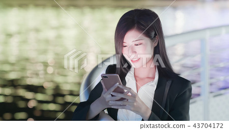 woman use phone at night woman use phone at night 43704172