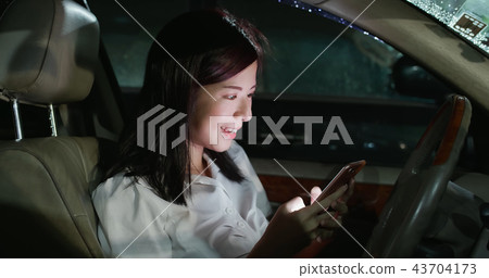 woman use phone in car woman use phone in car 43704173