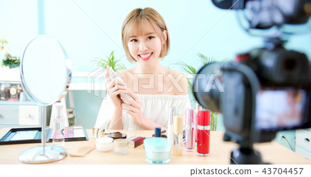 woman applying spray water 43704457