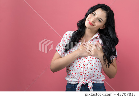 Woman with heartfelt expression 43707815