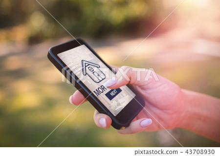 Composite image of graphic image of mortgage text and cityscape 43708930