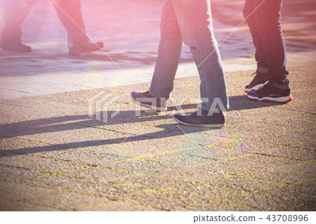 People walking on sidewalk People walking on sidewalk 43708996