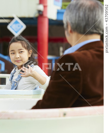 Family playing in the amusement park Family playing in the amusement park 43709562