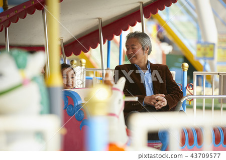 Family playing in the amusement park Family playing in the amusement park 43709577