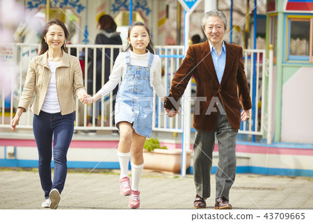 Family playing in the amusement park 43709665