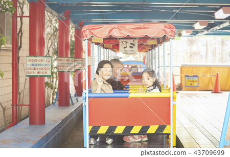 Family playing in the amusement park 43709699