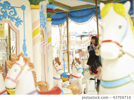 High school girl playing in amusement park High school girl playing in amusement park 43709718