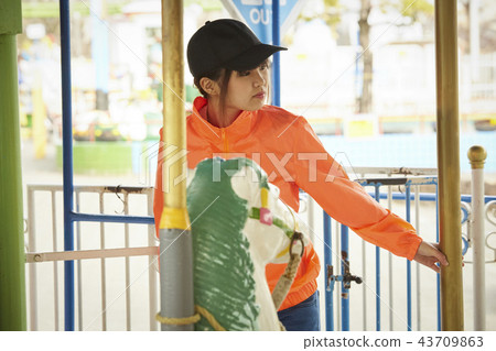 Girl doing part-time job in amusement park 43709863