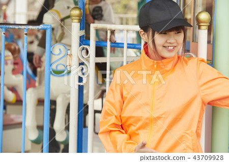Girl doing part-time job in amusement park 43709928