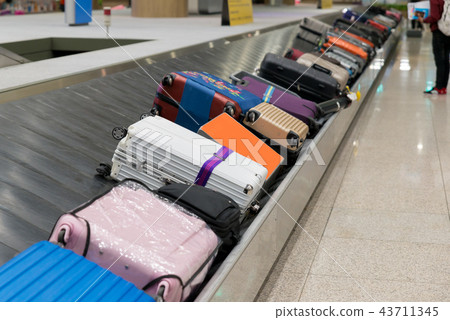 Luggage with conveyor belt in the airport.  43711345