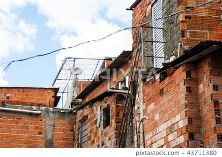 Orange worn brick houses of a favela in Brazil. Orange worn brick houses of a favela in Brazil. 43711380
