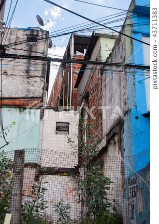 Colourful worn houses of a favela in Brazil. 43711383