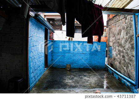 House in the slum with clothes hanging to dry. 43711387