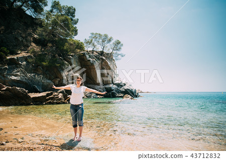 Young Caucasian Girl Woman Dressed In White Shirt And Blue Jeans Young Caucasian Girl Woman Dressed In White Shirt And Blue Jeans 43712832